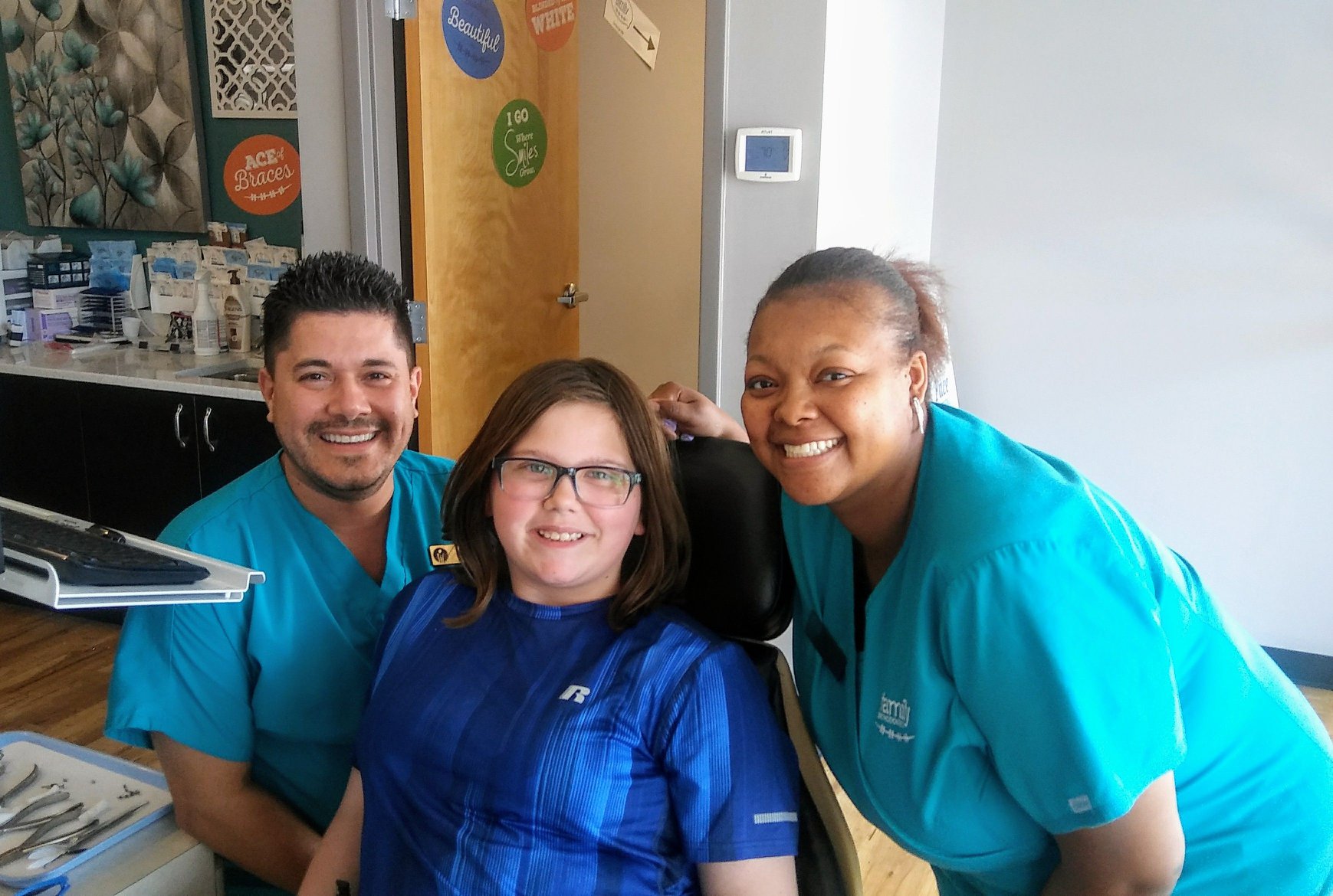 braces on patient with staff smiling